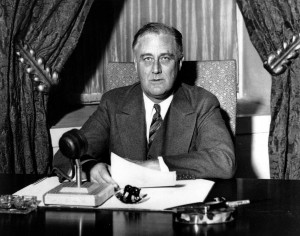 FILE -- President Franklin D. Roosevelt prepares to begin his first fireside chat to the American people in this March 12, 1933 file photo. Speaking to the nation on radio from the White House in Washington, Roosevelt explained in simple langauge the measures he was taking to solidify the nation's shaky banking system. Roosevelt had been in office less than 100 days. (AP Photo/File) ORG XMIT: WX30